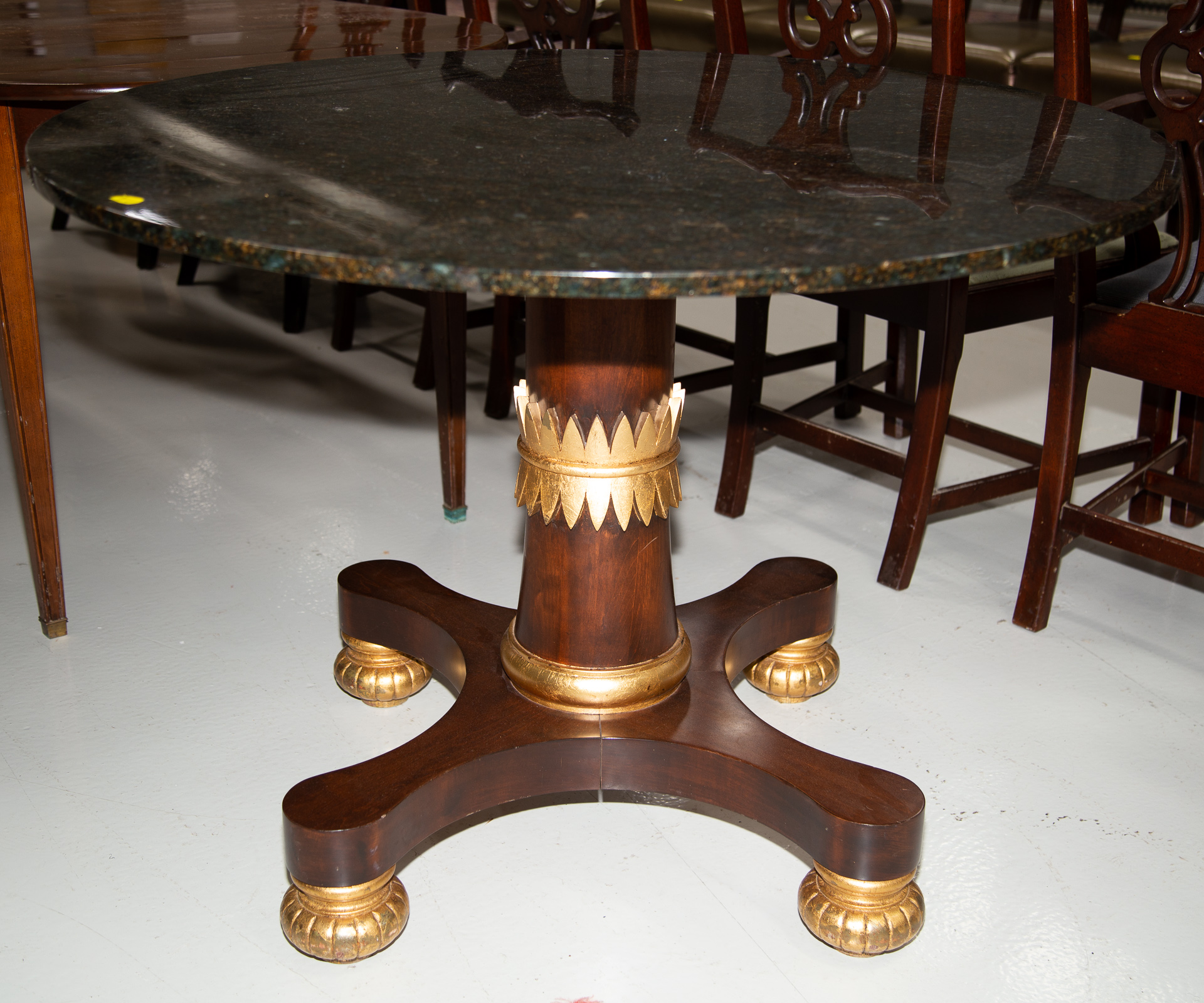 Appraisal: NEOCLASSICAL STYLE GRANITE TOP CENTER TABLE Modern Carved mahogany base