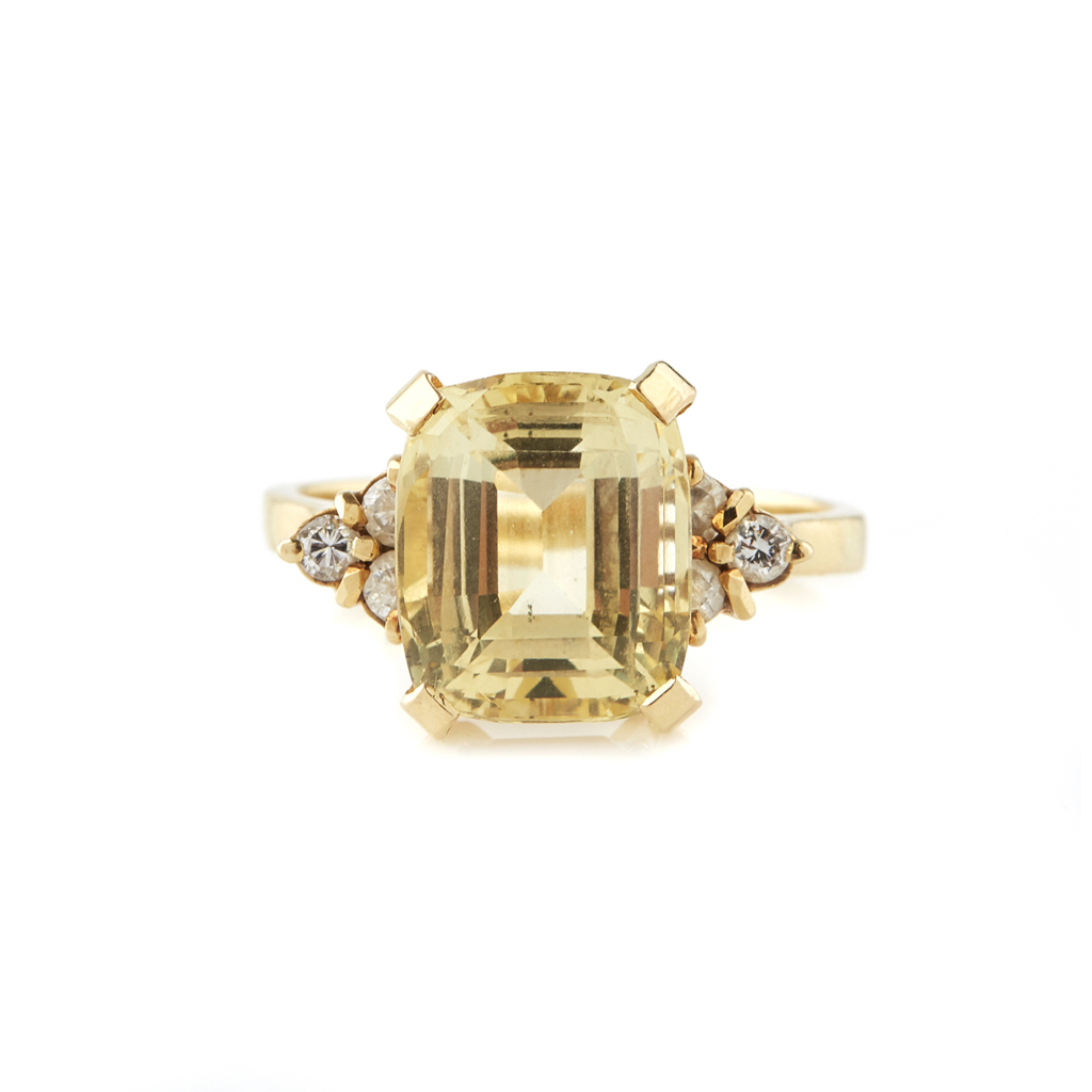 Appraisal: A yellow sapphire and diamond set ring claw set with