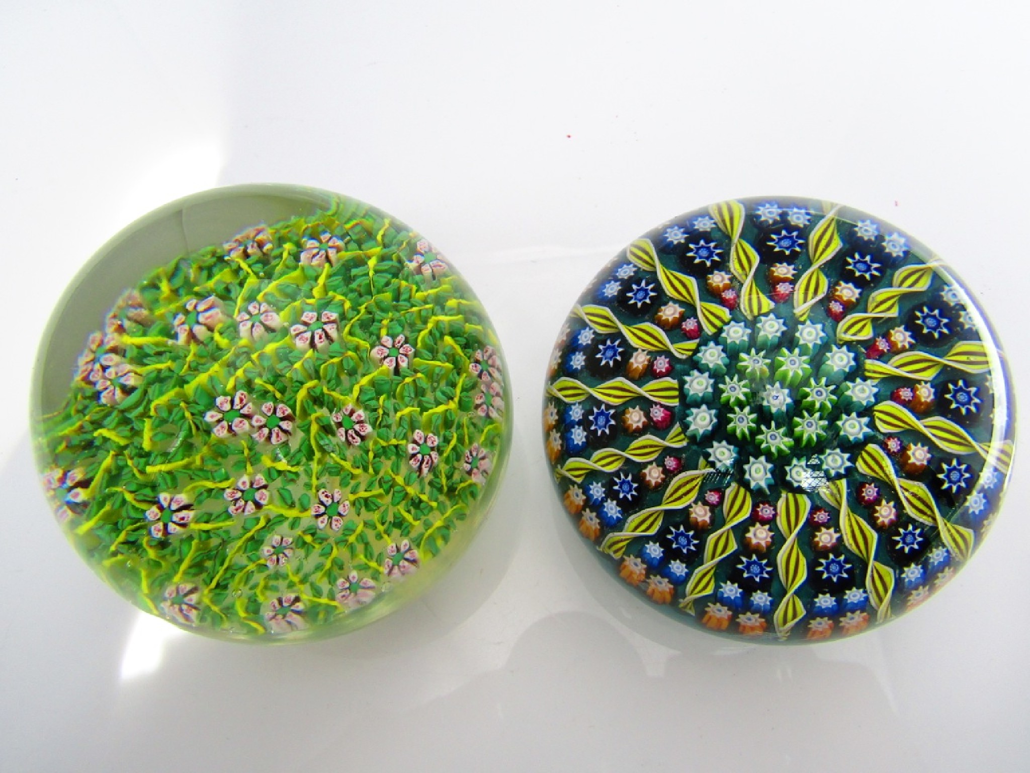 Appraisal: A Scottish millefiori glass paperweight by Perthshire together with one