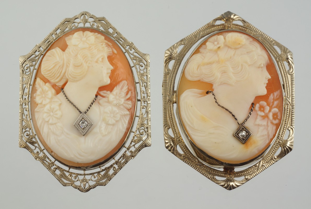 Appraisal: K WG carved shell cameo pins each with necklaces with