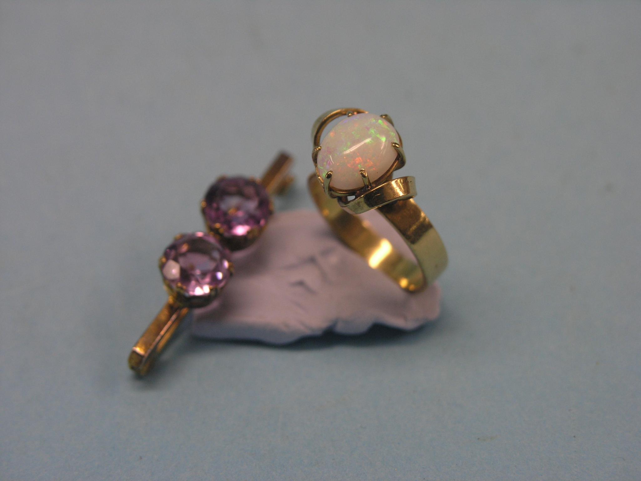 Appraisal: A ct gold dress ring claw-set with opal size O