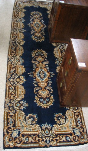 Appraisal: PERSIAN KERMAN RUNNER hand knotted in a pattern of two