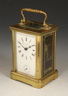 Appraisal: A brass corniche cased carriage clock with alarm with a