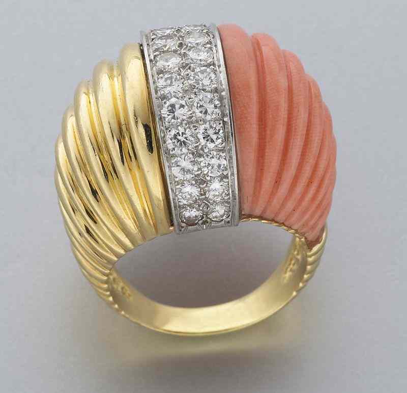 Appraisal: Platinum K gold coral and diamond ringfeaturing two central rows