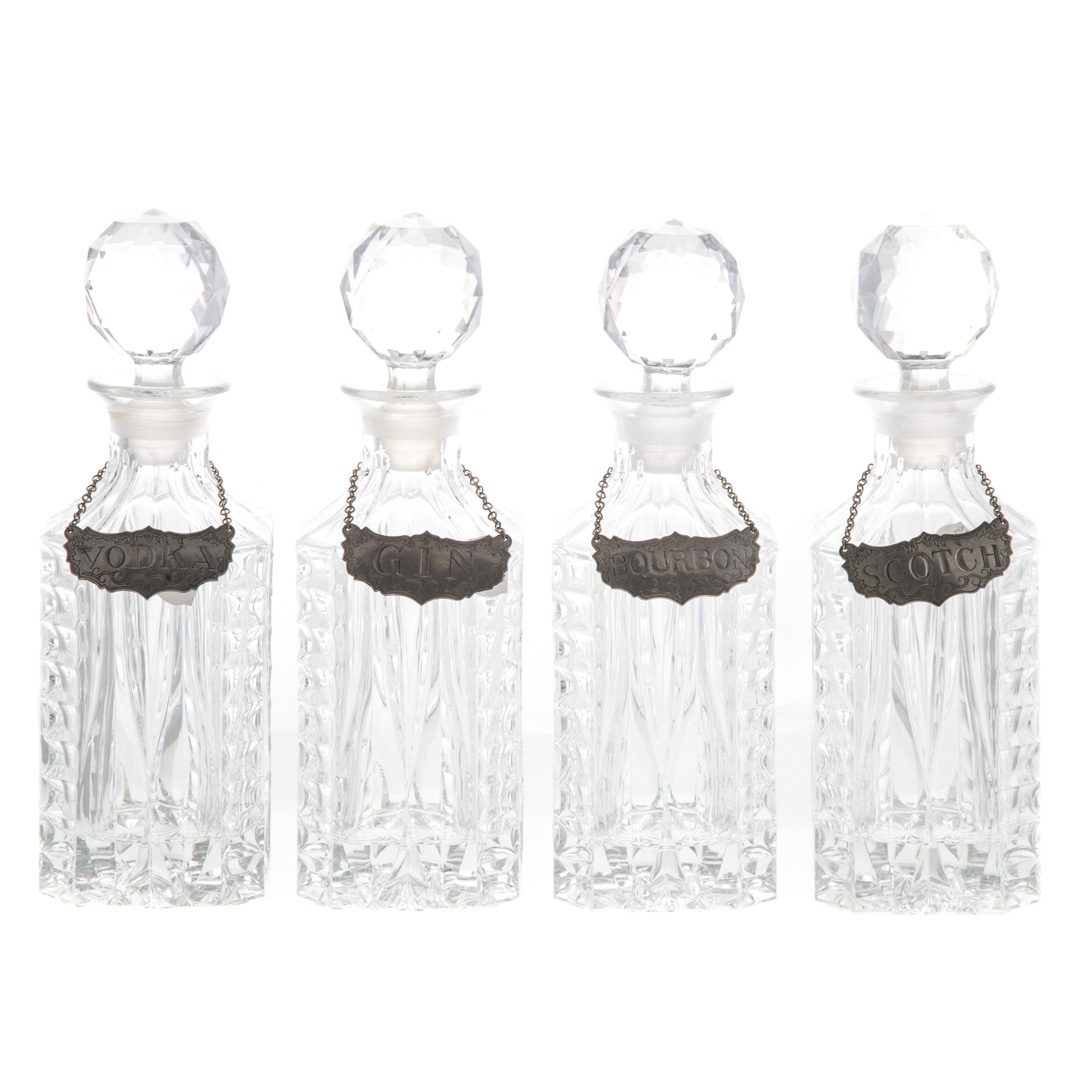 Appraisal: Four crystal liquor decanters with wood carrying trough each decanter