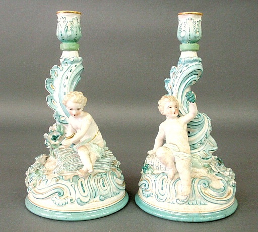 Appraisal: - Pair of early Meissen porcelain candlesticks with cherubs h