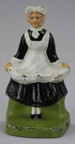 Appraisal: MAID DOORSTOP cJo depicts maid holding apron wears complete formal