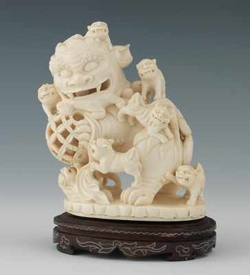 Appraisal: Carved Ivory Foo Lion with Pups on Stand Apprx -