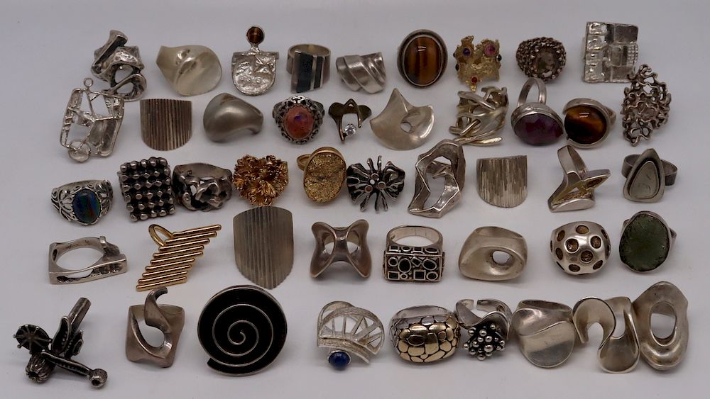 Appraisal: JEWELRY Grouping of Silver Rings Includes a signed sterling handhammered