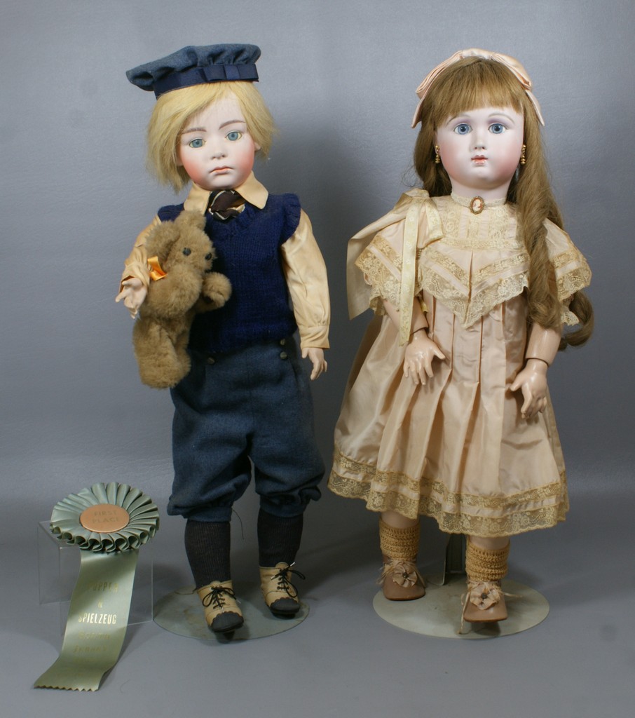 Appraisal: Reproduction Dolls the one dressed as a boy is a