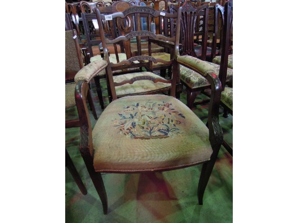 Appraisal: An Edwardian open elbow chair with shaped ladderback over a