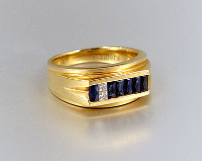 Appraisal: K GENTLEMENS SAPPHIRE DIAMOND RING K yellow gold ring contains