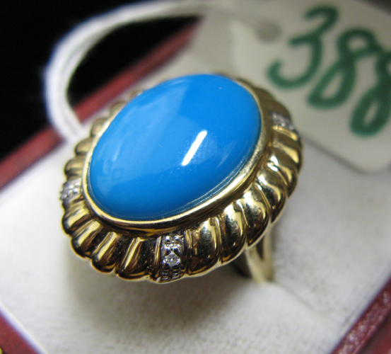 Appraisal: TURQUOISE DIAMOND AND FOURTEEN KARAT GOLD RING centering an oval