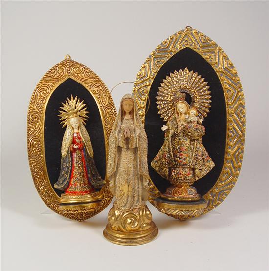 Appraisal: Three Hand-Carved Madonnas Mexican hand-carved and hand-painted mahogany statues of