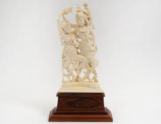 Appraisal: CARVED IVORY GROUP Indian Of a deity and his consort