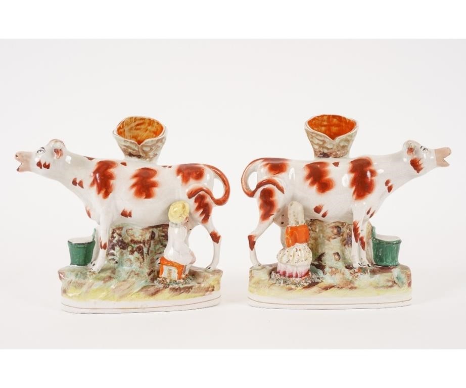 Appraisal: Pair of Staffordshire cow spill vases circa h x l