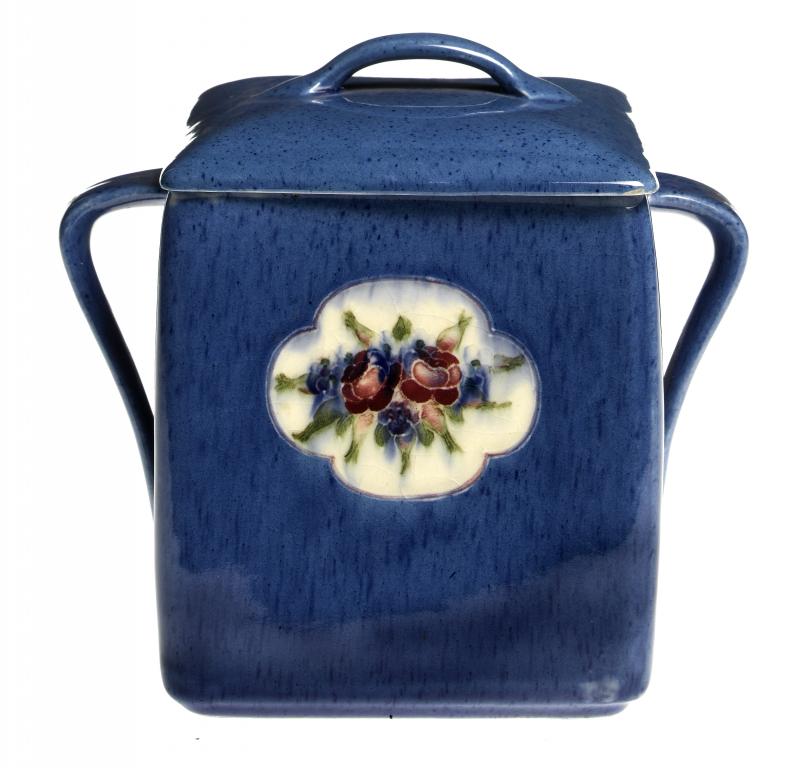 Appraisal: A MOORCROFT FLORAL POWDER BLUE BISCUIT BOX AND COVER DESIGNED