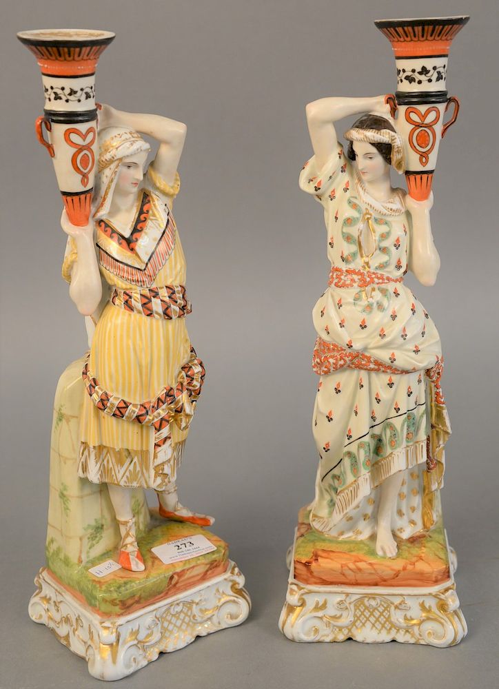 Appraisal: Pair of porcelain figural candlesticks Eastern man and woman holding