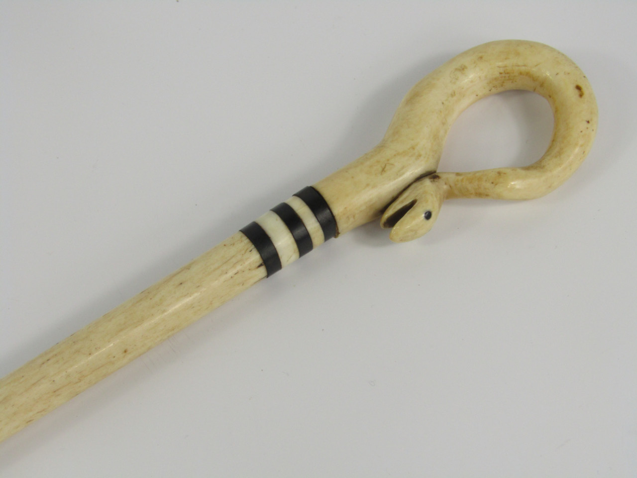 Appraisal: A marine ivory walking stick mid thC carved with a