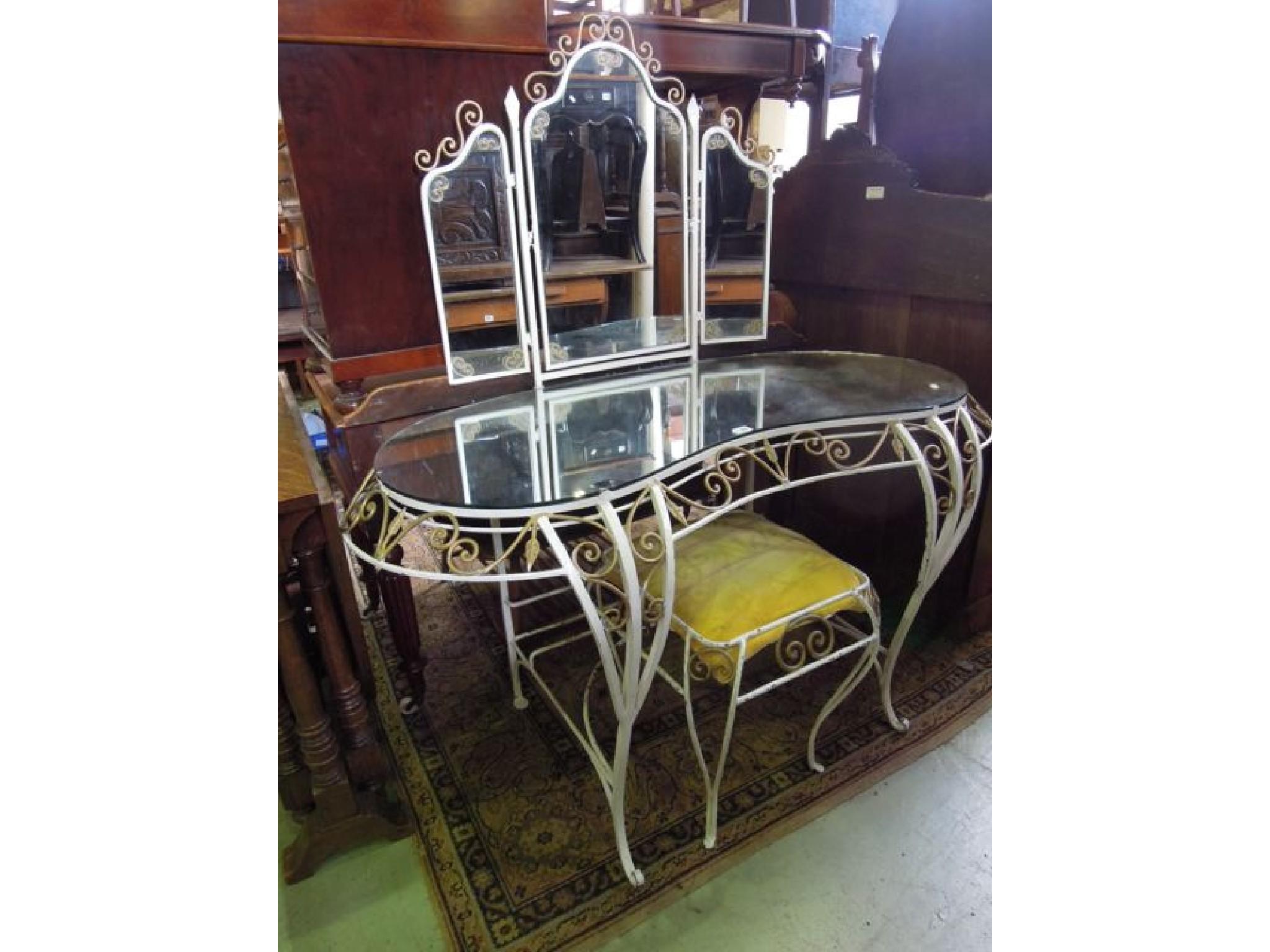 Appraisal: A decorative kneehole dressing table of kidney shaped form with