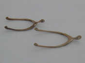 Appraisal: Two pairs of silver wishbone sugar tongs Birmingham and respectively