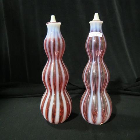 Appraisal: Pair of Cranberry Opalescent Barber Bottles ribbed design pinch shape