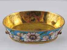 Appraisal: A gilt metal tests silver and enamel oval dish approx