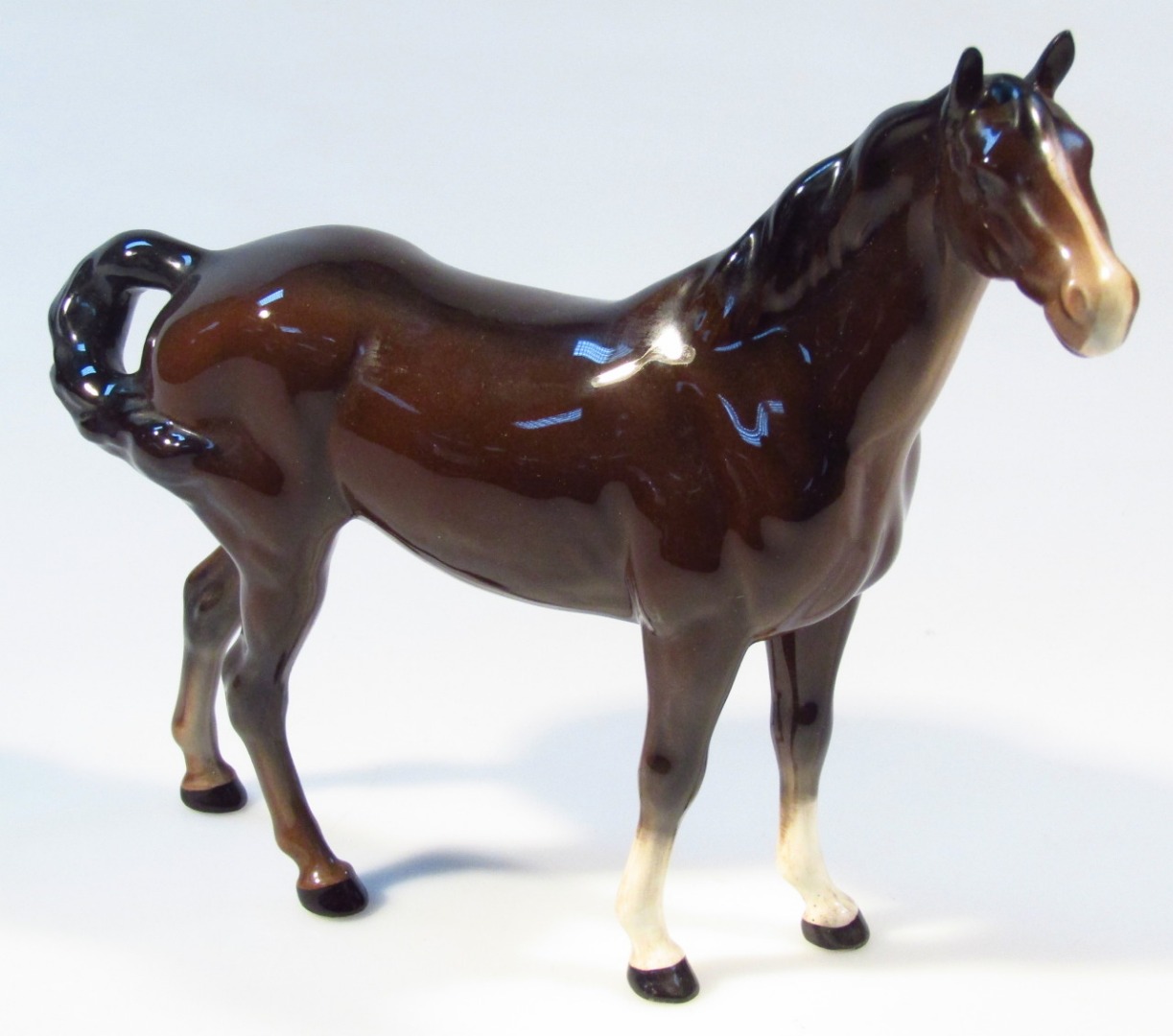 Appraisal: A Beswick standing horse brown colourway white stripe to face