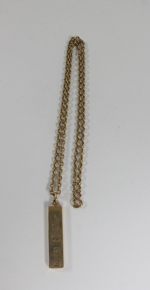 Appraisal: A ct gold hallmark ingot and a ct gold chain