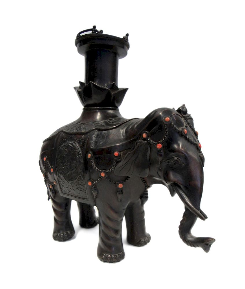 Appraisal: Possibly Coral Inlaid Bronze Elephant The elephant outfitted with an