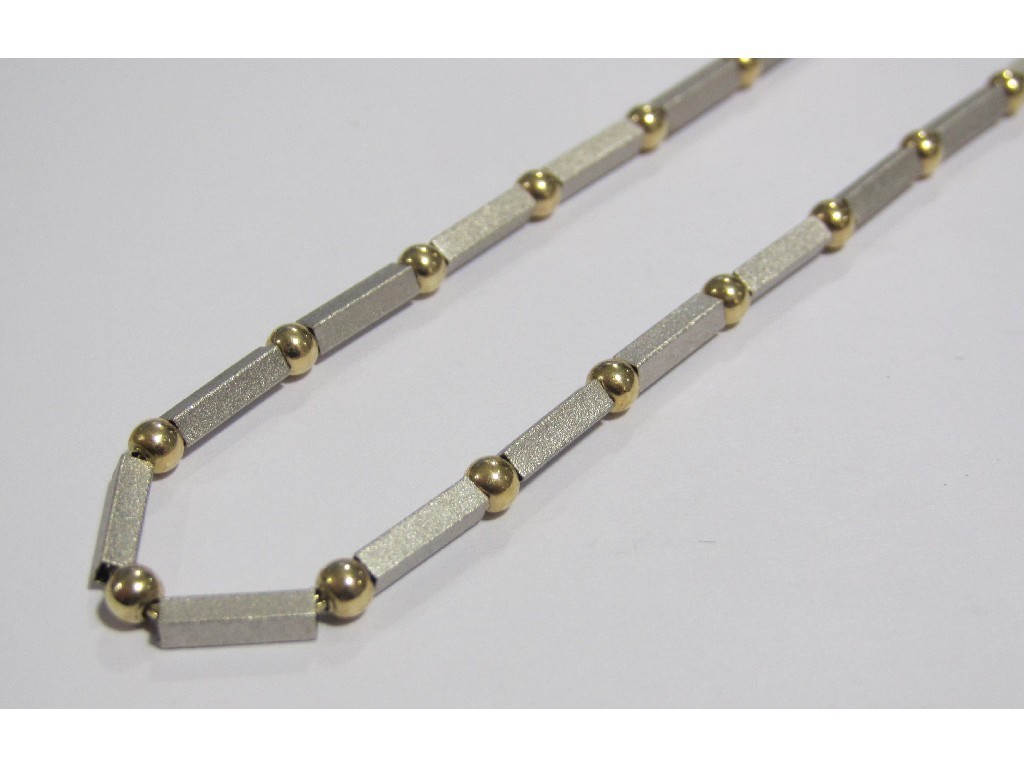 Appraisal: Fourteen carat gold necklace with threaded white gold bars with