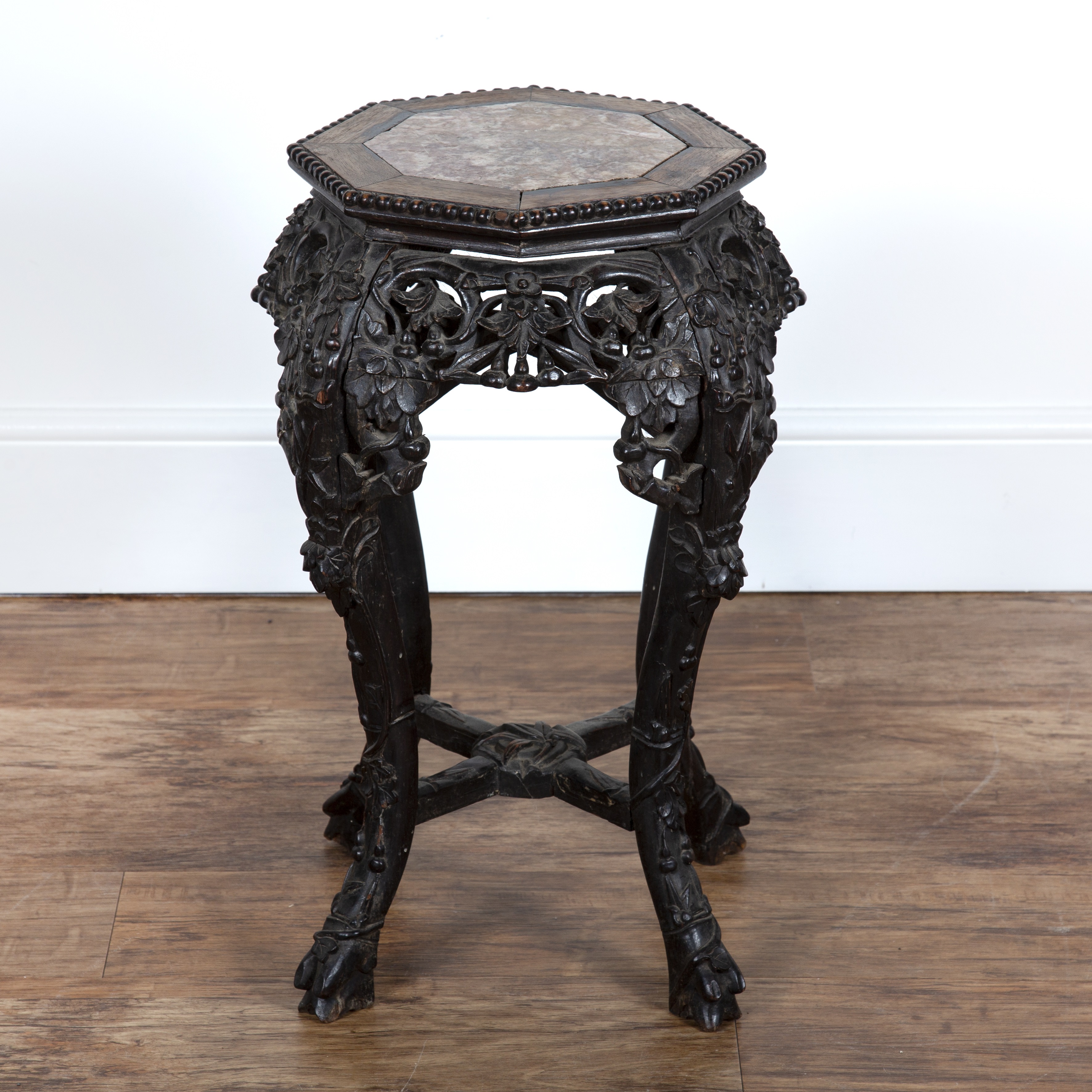 Appraisal: Carved hardwood urn stand Chinese circa with inset octagonal marble