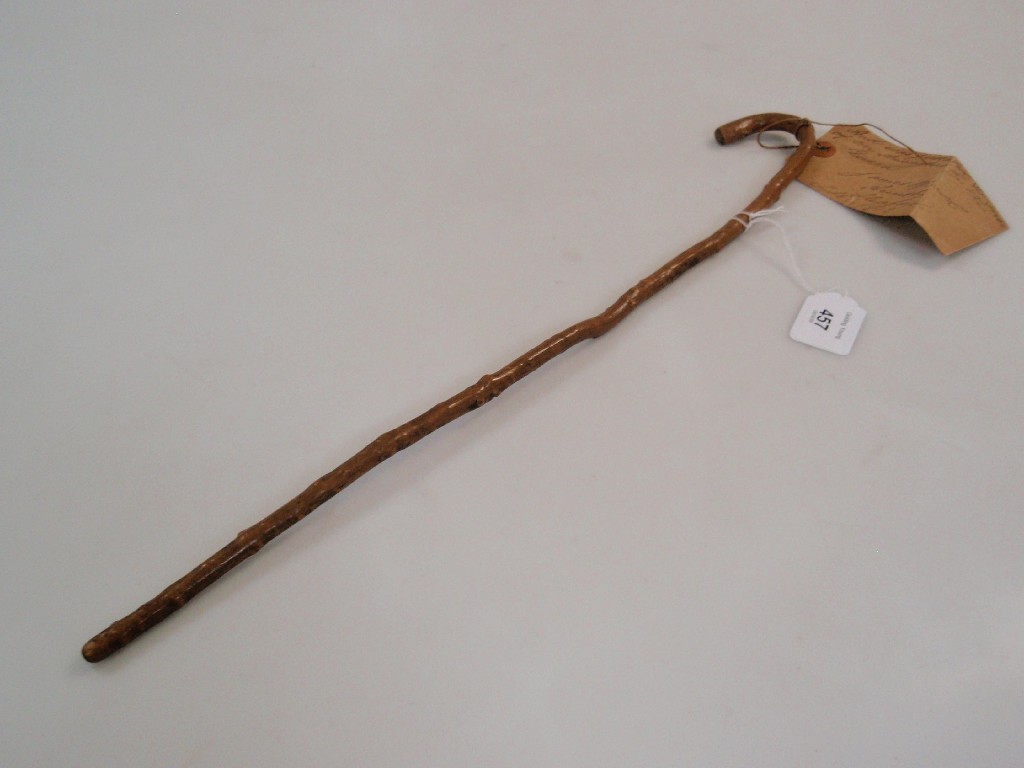 Appraisal: A Swagger stick formed from a walking stick shape branch