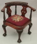 Appraisal: Carved Corner Chair ca th Century Heavily carved arm rests