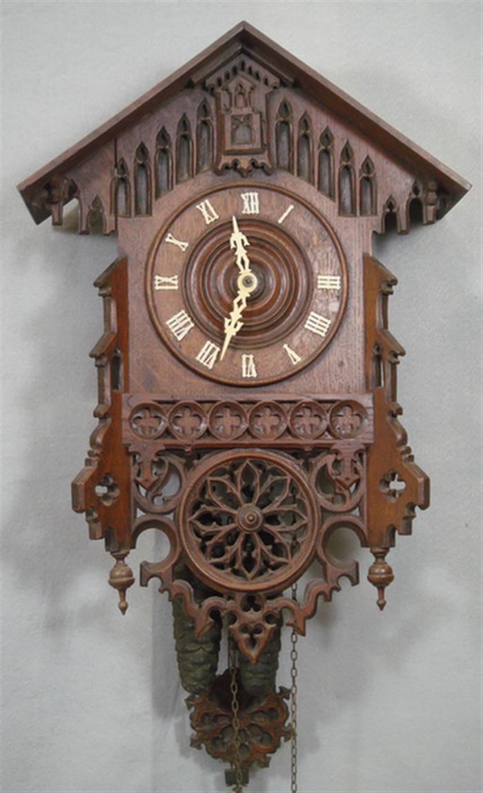 Appraisal: Carved Black Forest cuckoo clock Gothic design weights pendulum high