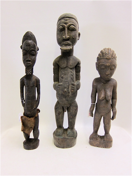 Appraisal: THREE WOOD CARVED AFRICAN FIGURES in the form of standing