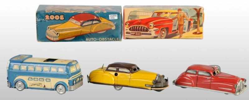 Appraisal: Lot of Tin Vehicle Wind-Up Toys Description French Working Includes