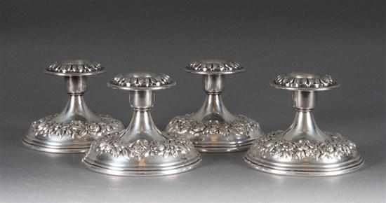 Appraisal: Four American repousse weighted sterling silver candle holders S Kirk