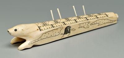 Appraisal: Engraved seal cribbage board carved and engraved walrus tusk with