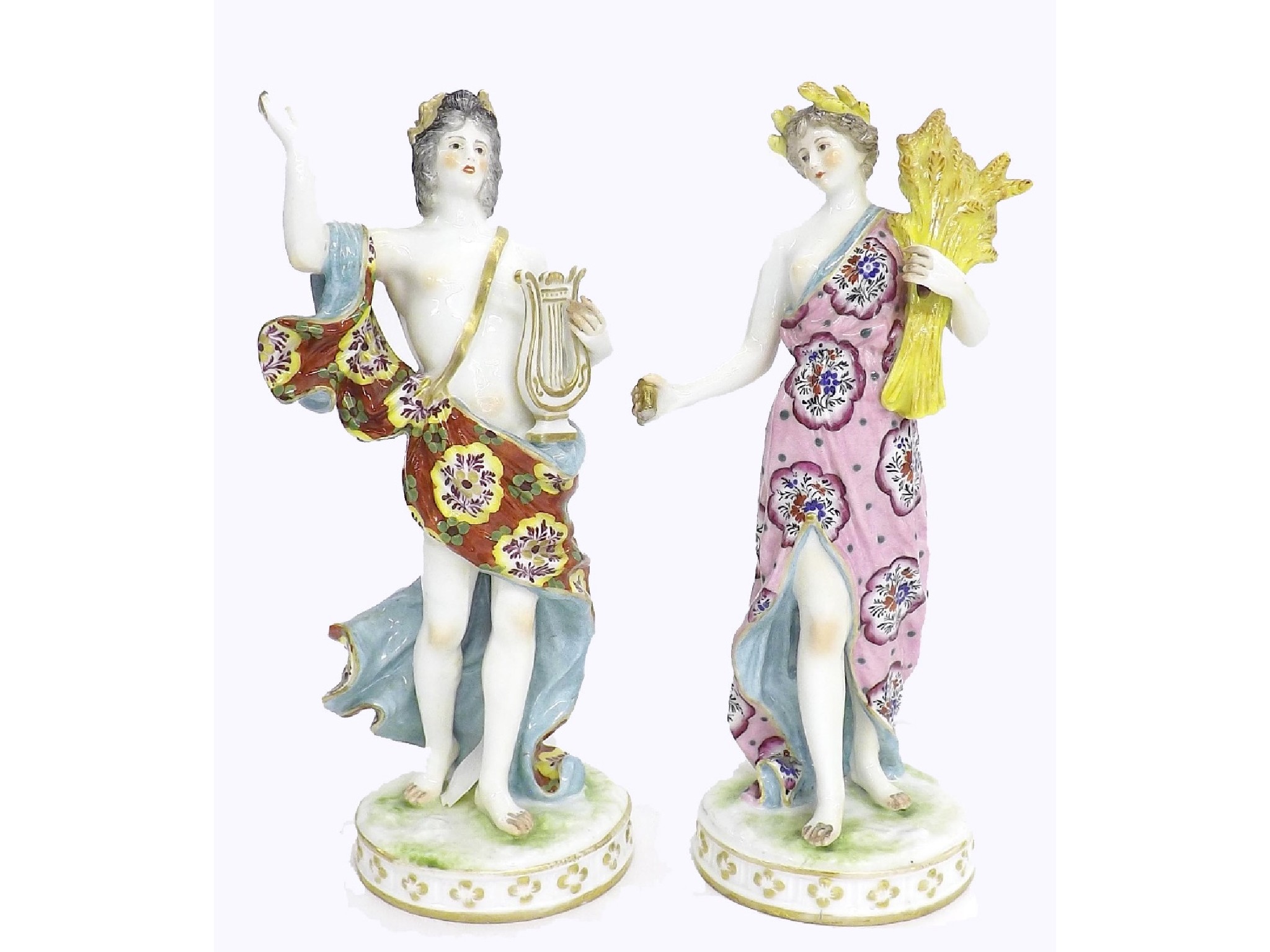 Appraisal: Pair of Continental porcelain figures of robed maidens one carrying