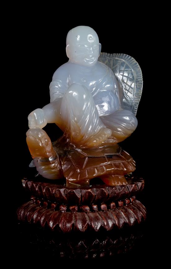 Appraisal: Sale Lot A Carved Agate Figural Group depicting a boy