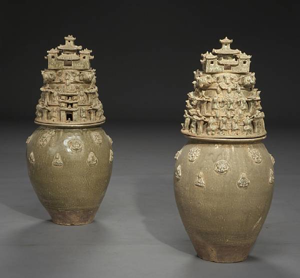 Appraisal: A pair of Chinese glazed earthenware covered vases The ovoid