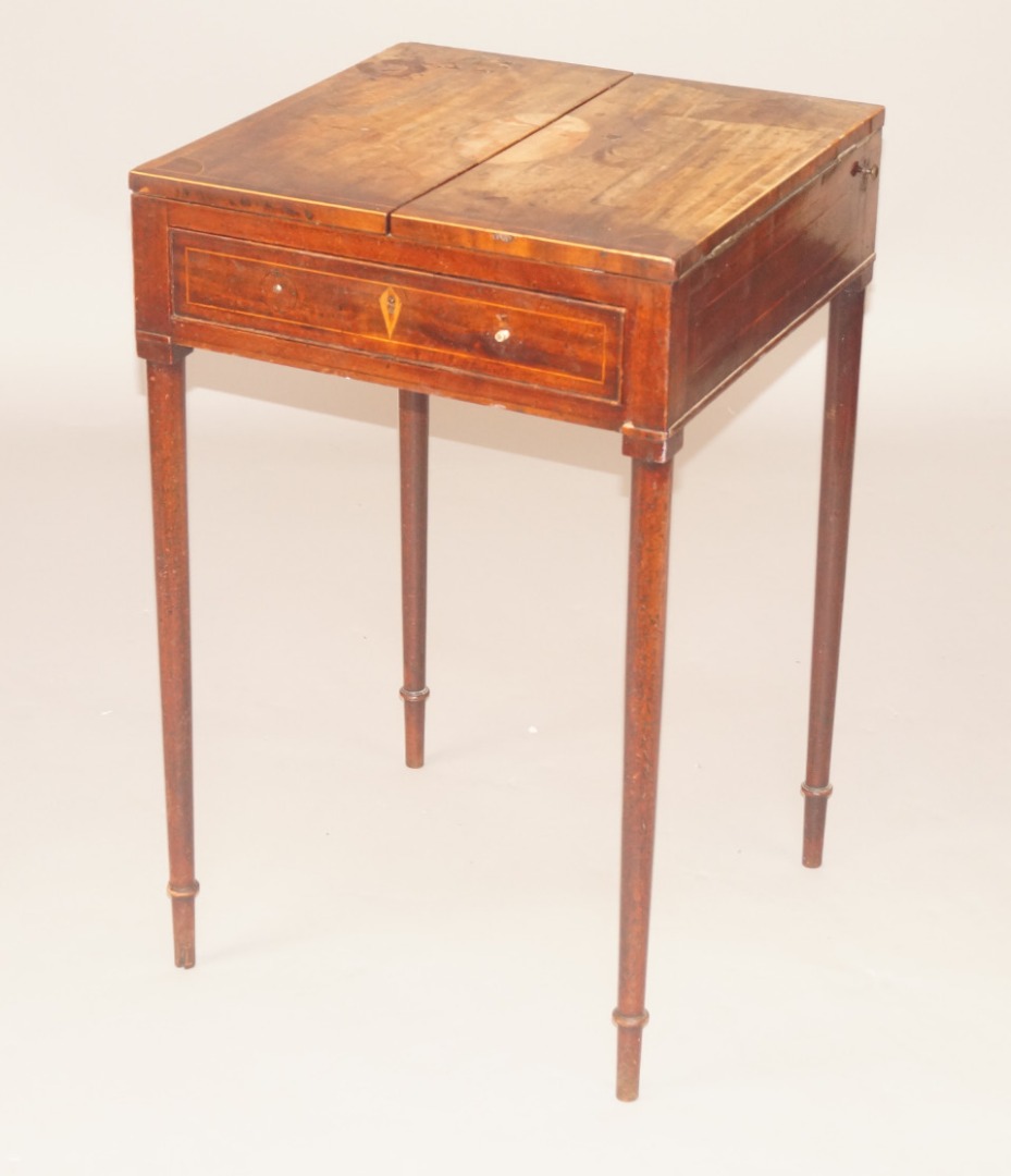 Appraisal: A George III mahogany card table the double hinged top