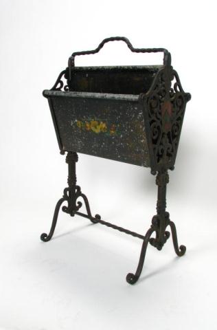 Appraisal: Wrought iron and cast metal tole-painted periodicals stand with crest