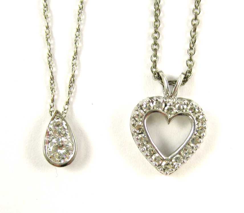 Appraisal: TWO DIAMOND AND WHITE GOLD PENDANT NECKLACES the first with