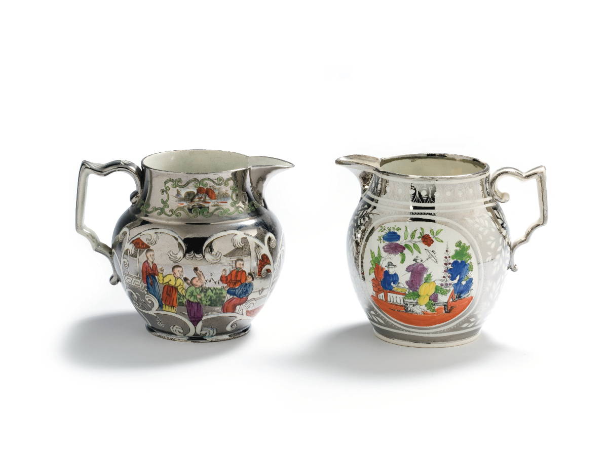 Appraisal: TWO STAFFORDSHIRE SILVER RESIST AND ENAMEL-DECORATED JUGS CIRCA - Each