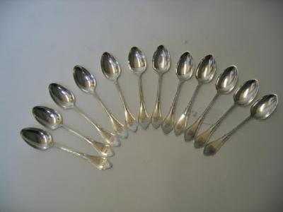 Appraisal: A SET OF TWELVE AMERICAN DESSERT SPOONS by Henrichsen Greenberg