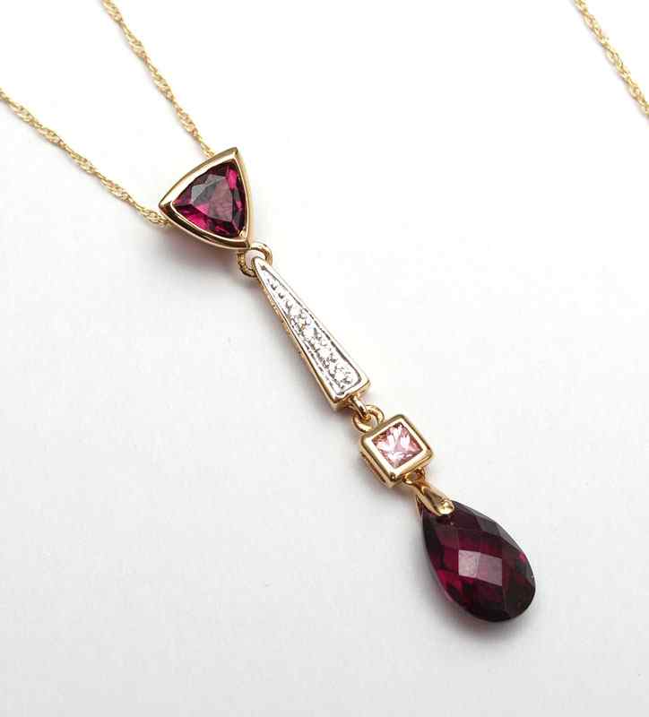 Appraisal: K DIAMOND GEMSTONE PENDANT CHAIN K yellow gold pendant contains