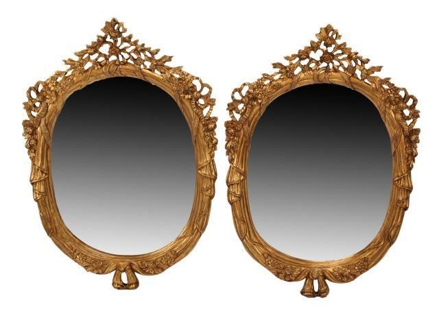 Appraisal: pair Italian Louis XV style carved giltwood oval mirrors approx