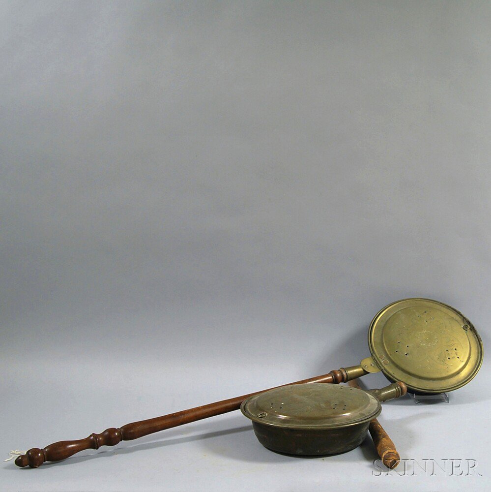 Appraisal: Two Engraved Brass and Turned Wood Bed Warmers th century